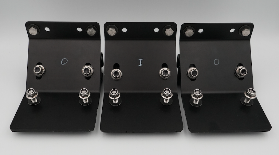 Three black metal bracket hardware pieces with silver bolts and washers, arranged side by side on a light gray background.